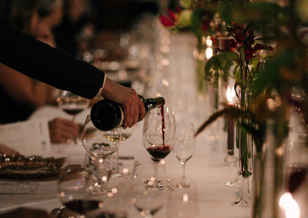 A person pouring wine into a glass
AI-generated content may be incorrect.